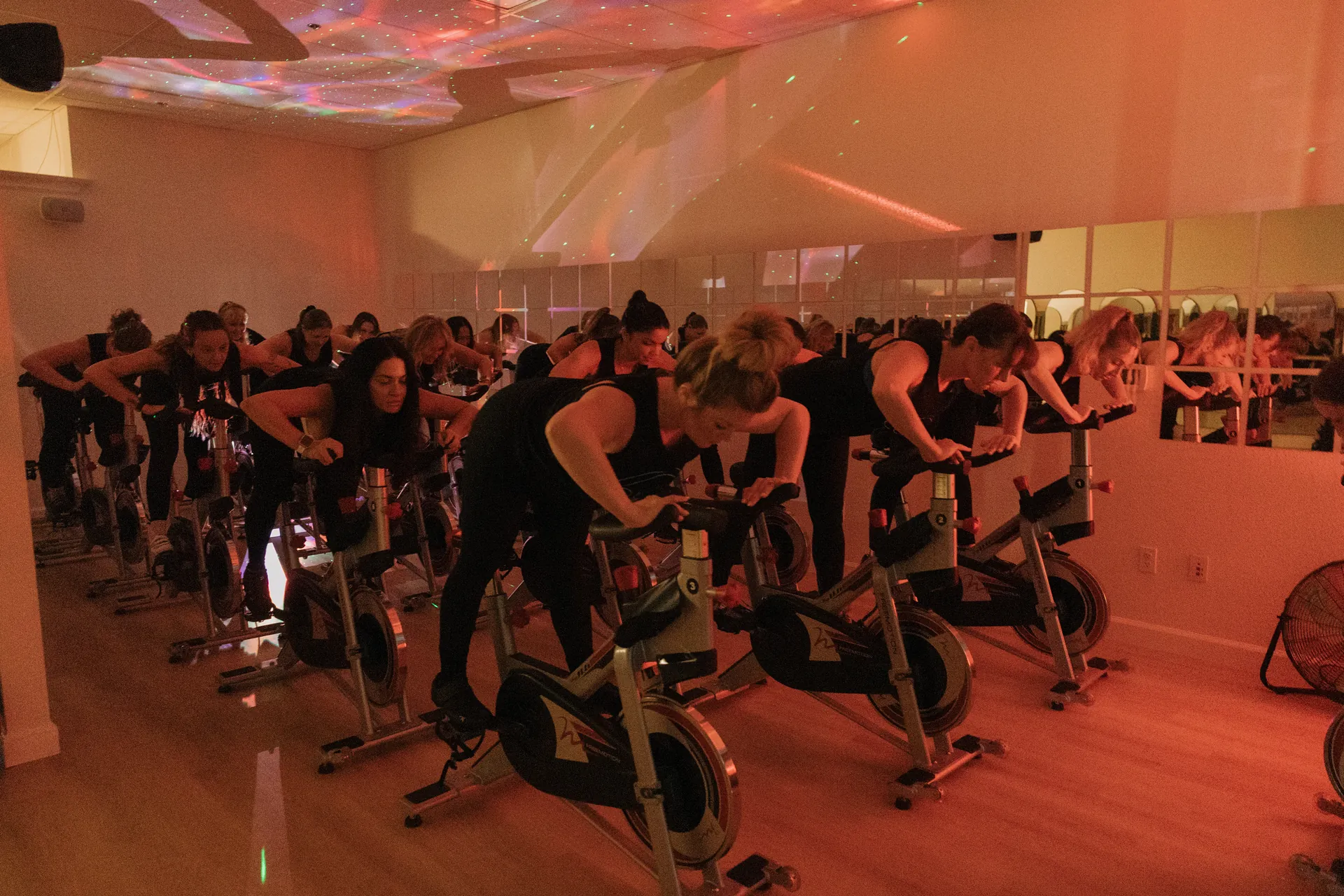Cycle class at Copas Crew Fitness — indoor cycling in a vibrant studio